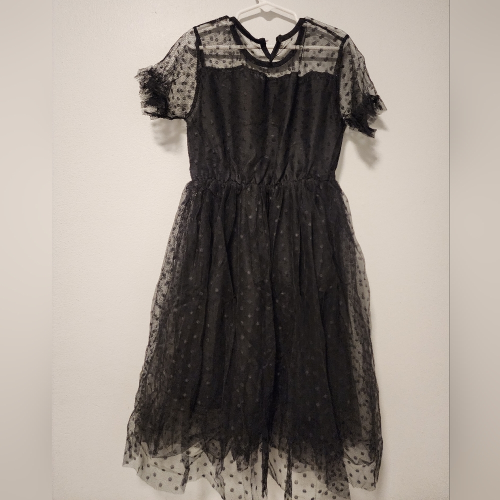 A beautiful black dress for a little girl.